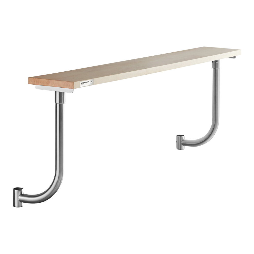 A long, rectangular wooden board mounted on two metal brackets attached to a wall.