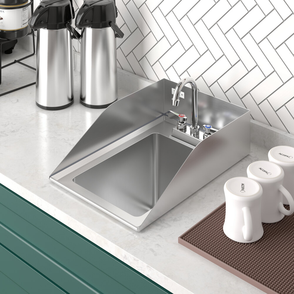 A Regency stainless steel drop-in sink with side splashes on a counter.