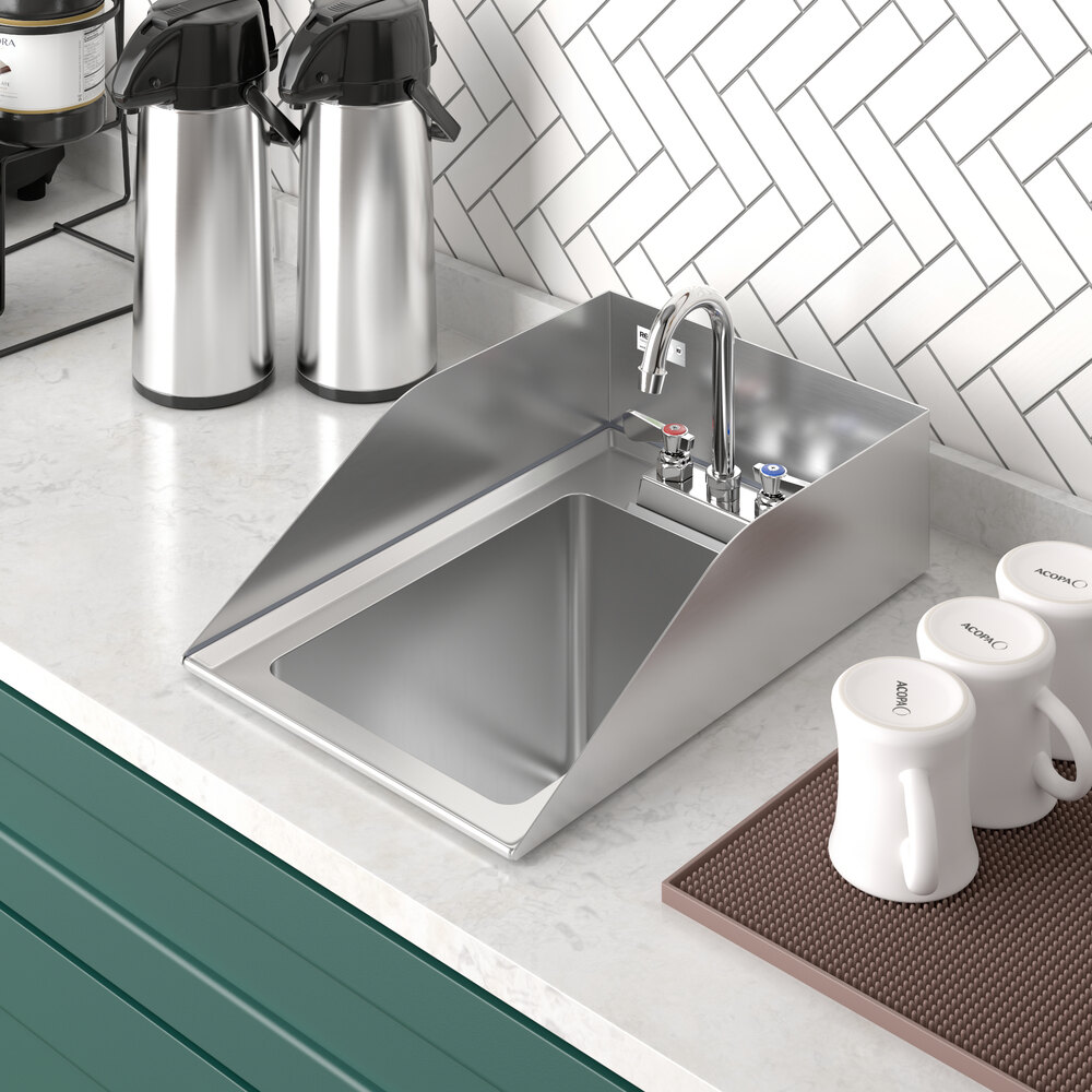 A stainless steel drop-in sink with high side splashes and a gooseneck faucet, installed on a countertop next to coffee dispensers and mugs.