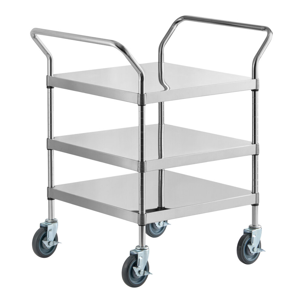 A three-tier stainless steel utility cart with handles on both sides and four swivel caster wheels.