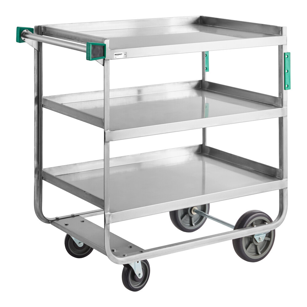 A three-shelf stainless steel utility cart with a handle and four wheels, two of which are larger and positioned at the rear.
