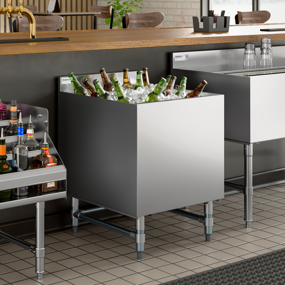 A stainless steel beer box filled with ice and bottled beverages, designed for bar use.