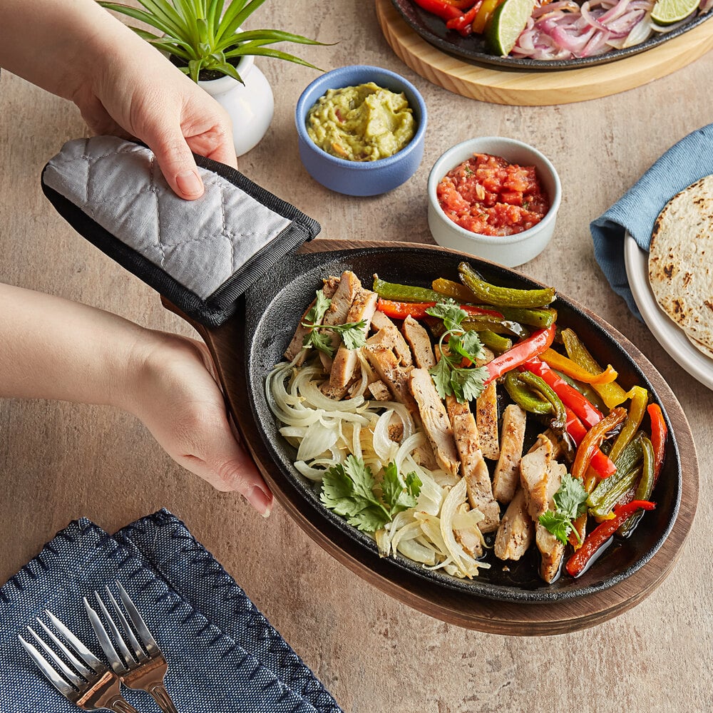 Choice 9 1/4 x 7 Oval Pre-Seasoned Cast Iron Fajita Skillet with Oak  Finish Wood Underliner and Grey Silicone Handle Cover