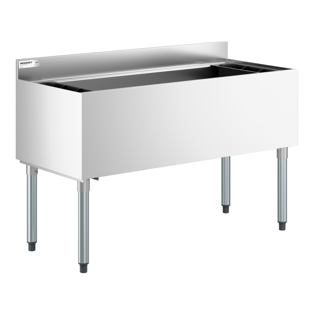 A stainless steel underbar ice bin with four legs and bottle holders, featuring a rectangular open top and a backsplash.