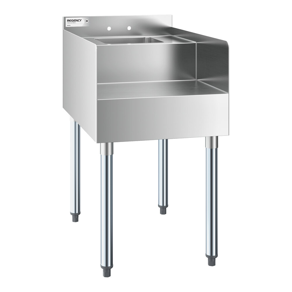 A stainless steel station with four legs, a raised back and sides, and a small integrated sink.