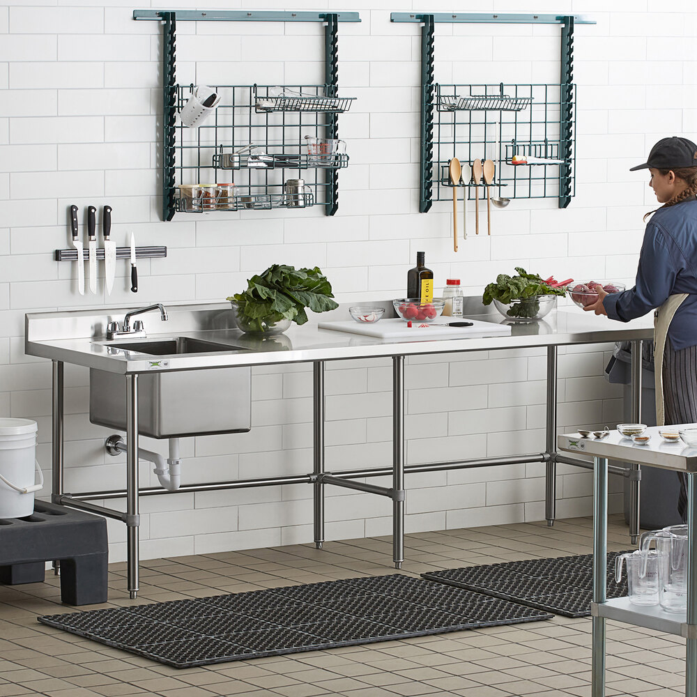 A stainless steel work table with a left-side sink, faucet, and cross bracing, designed for commercial kitchen use.