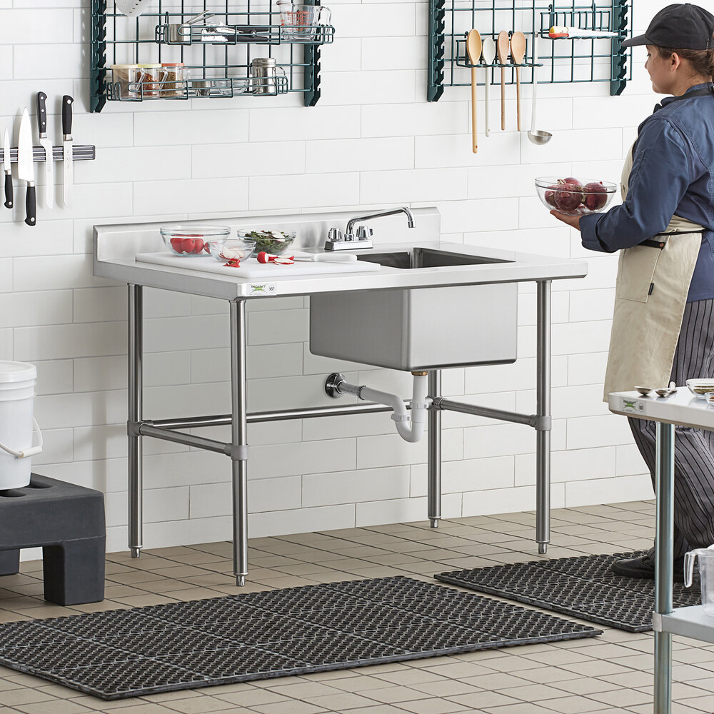 A stainless steel work table with a right-side sink, faucet, and cross bracing.
