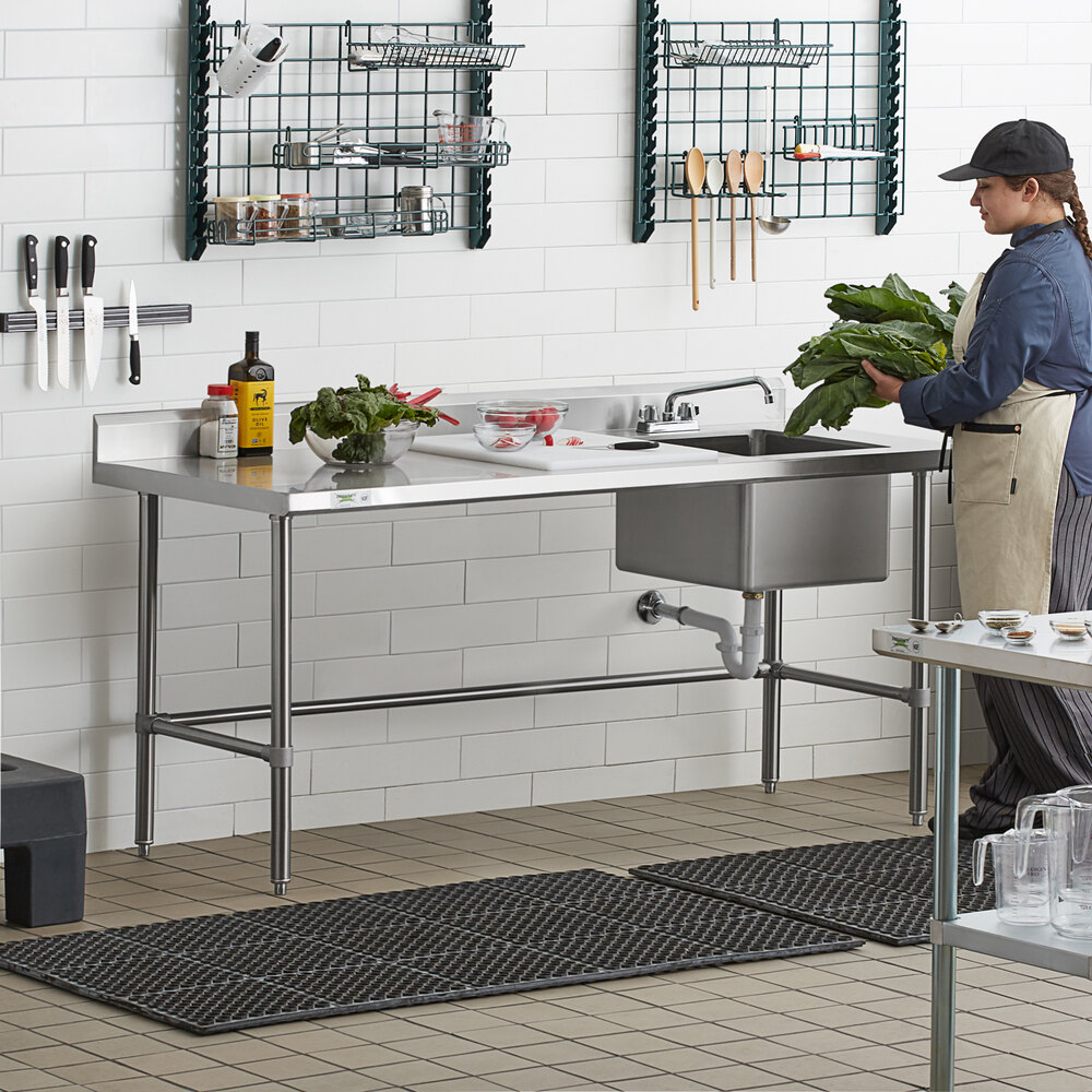 A stainless steel work table with a right-side sink, faucet, and cross bracing.