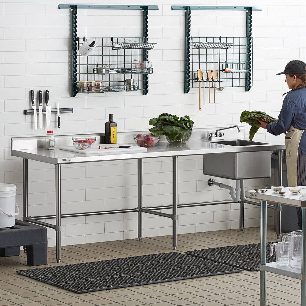 A stainless steel work table with a right-side sink, faucet, and cross bracing, designed for commercial kitchen use.