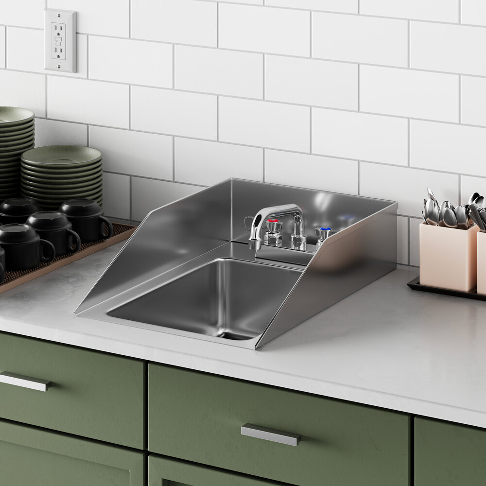 A Regency stainless steel drop-in sink with side splashes on a counter.