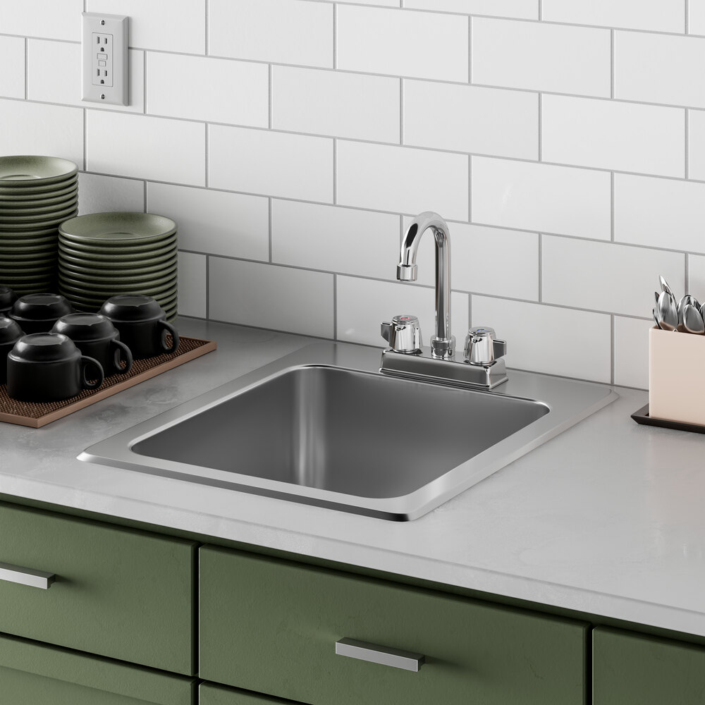 A Regency drop-in sink with a faucet and a tray of dishes above it.