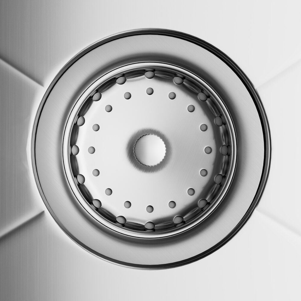 A close up of the drain on a Regency stainless steel sink.