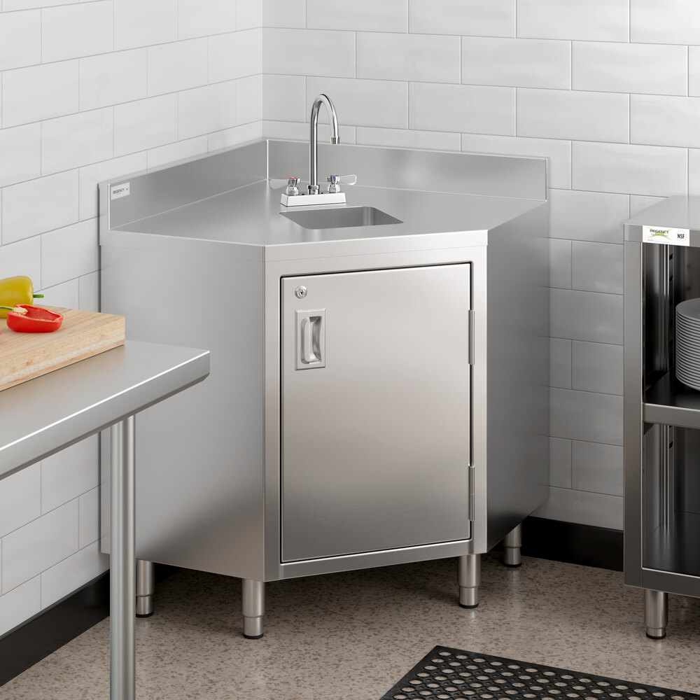 A Regency stainless steel corner work table with a sink in a kitchen.