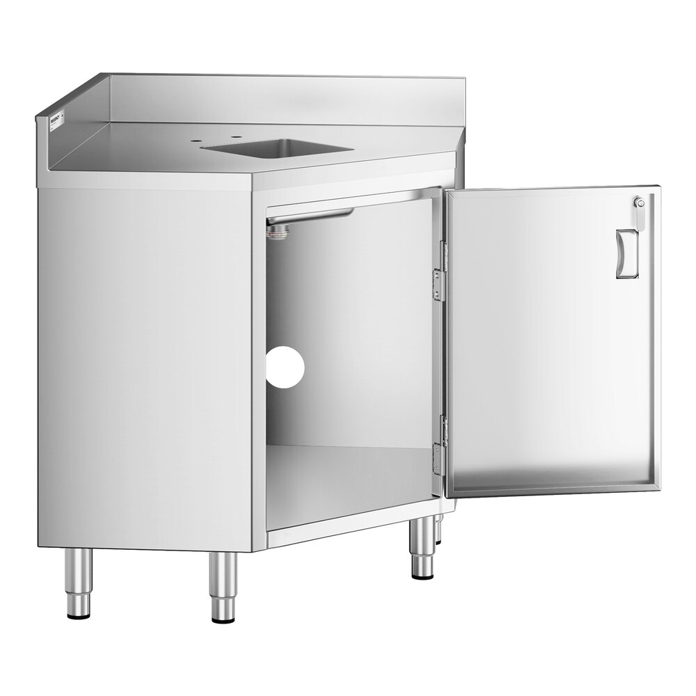 A stainless steel corner work table with a built-in sink, an open hinged door revealing storage space underneath, and four sturdy legs.