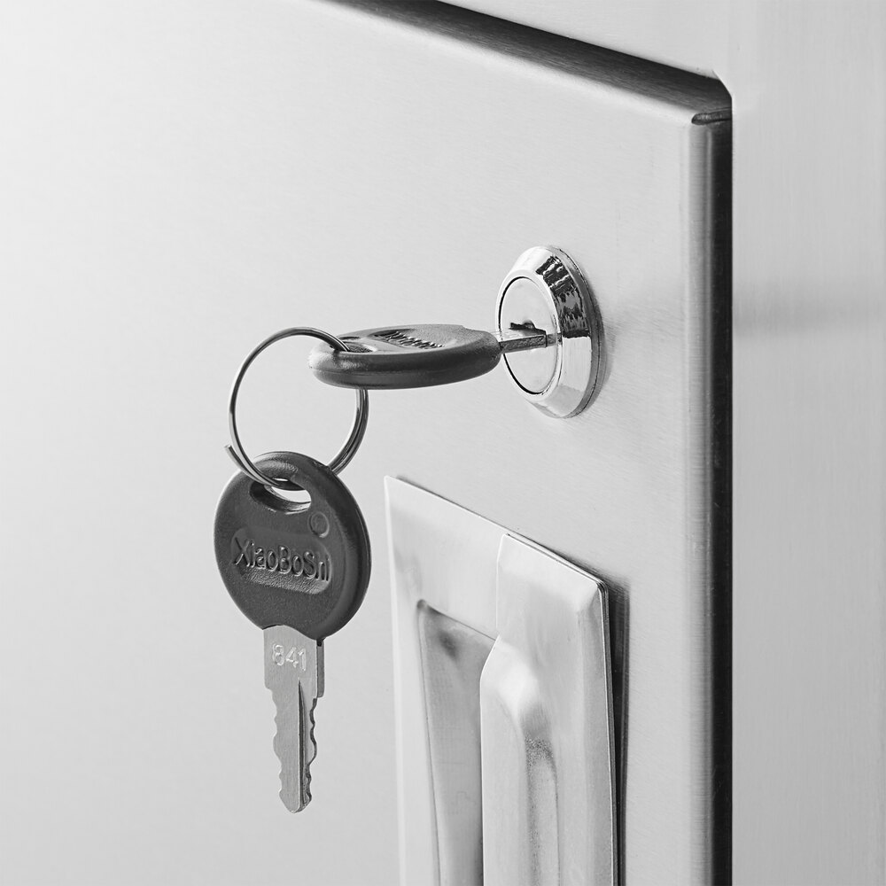 The left sink on a Regency stainless steel beverage table with a key in the keyhole.
