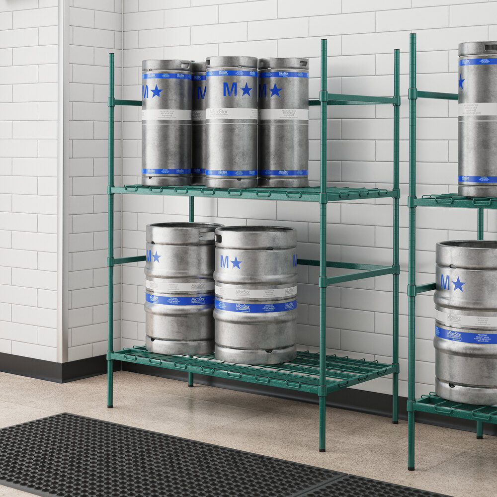 A Regency green epoxy metal rack holding several beer kegs.