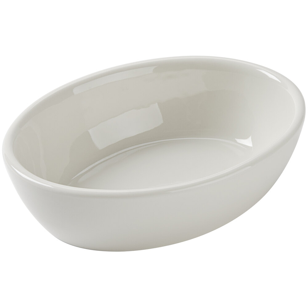 Tuxton BEK-160 16 oz. Eggshell Oval China Baker Dish / Bowl - 12/Case