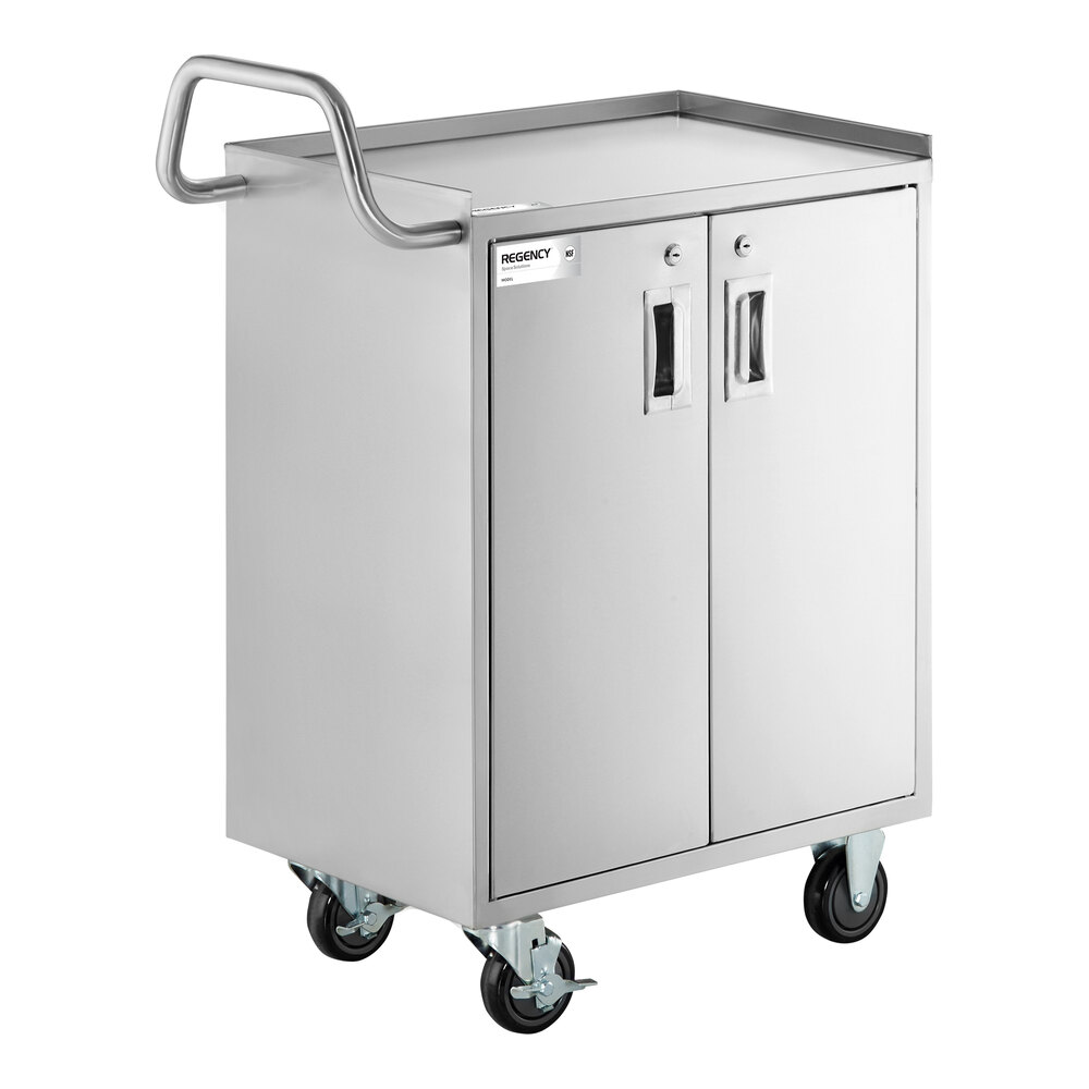 A stainless steel utility cart with an enclosed base, two locking doors, a handle, and four caster wheels.