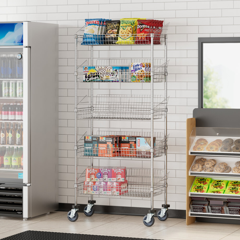 A Regency chrome mobile storage display stand with baskets holding food and beverages in a convenience store.