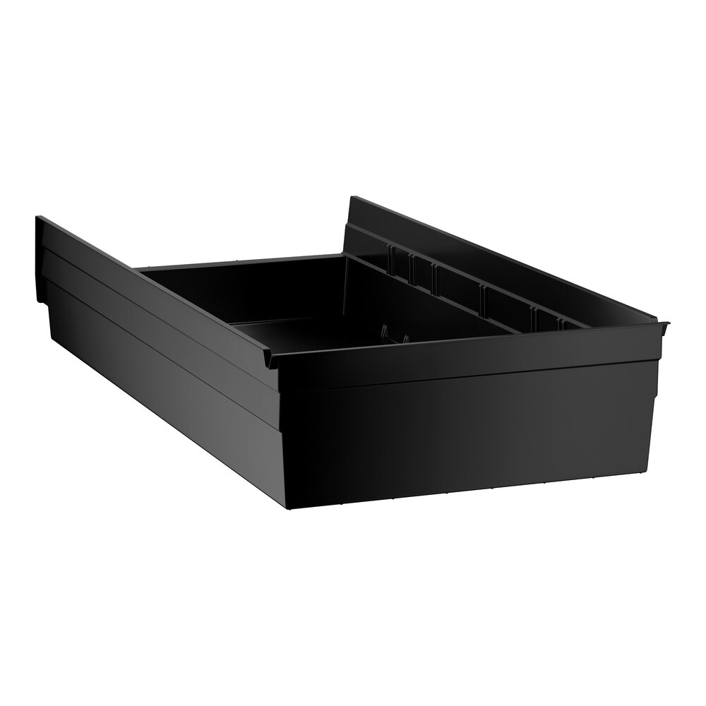 A black rectangular plastic bin with raised sides and an open top, viewed at an angle.