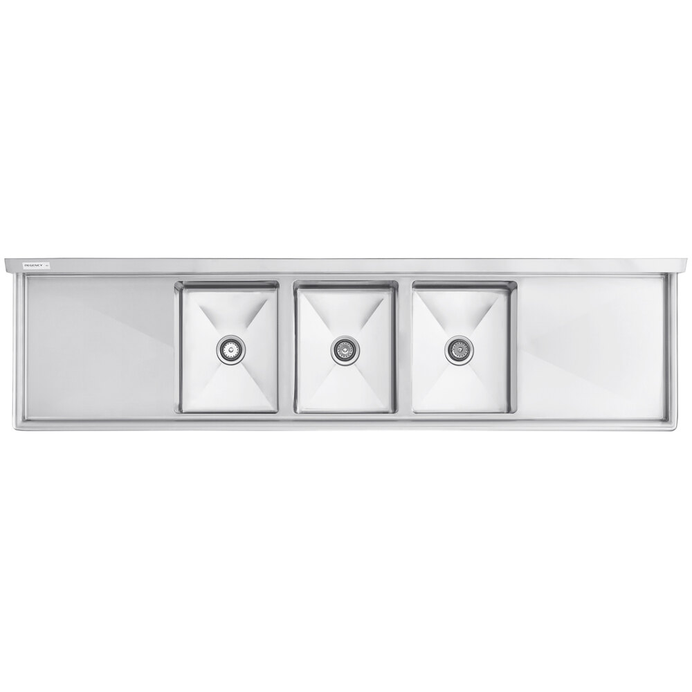 A Regency stainless steel three compartment sink with two drainboards.
