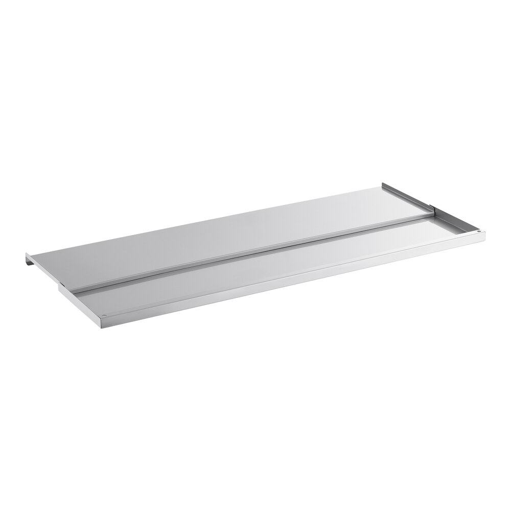 A rectangular, flat, stainless steel sliding lid with raised edges on three sides.