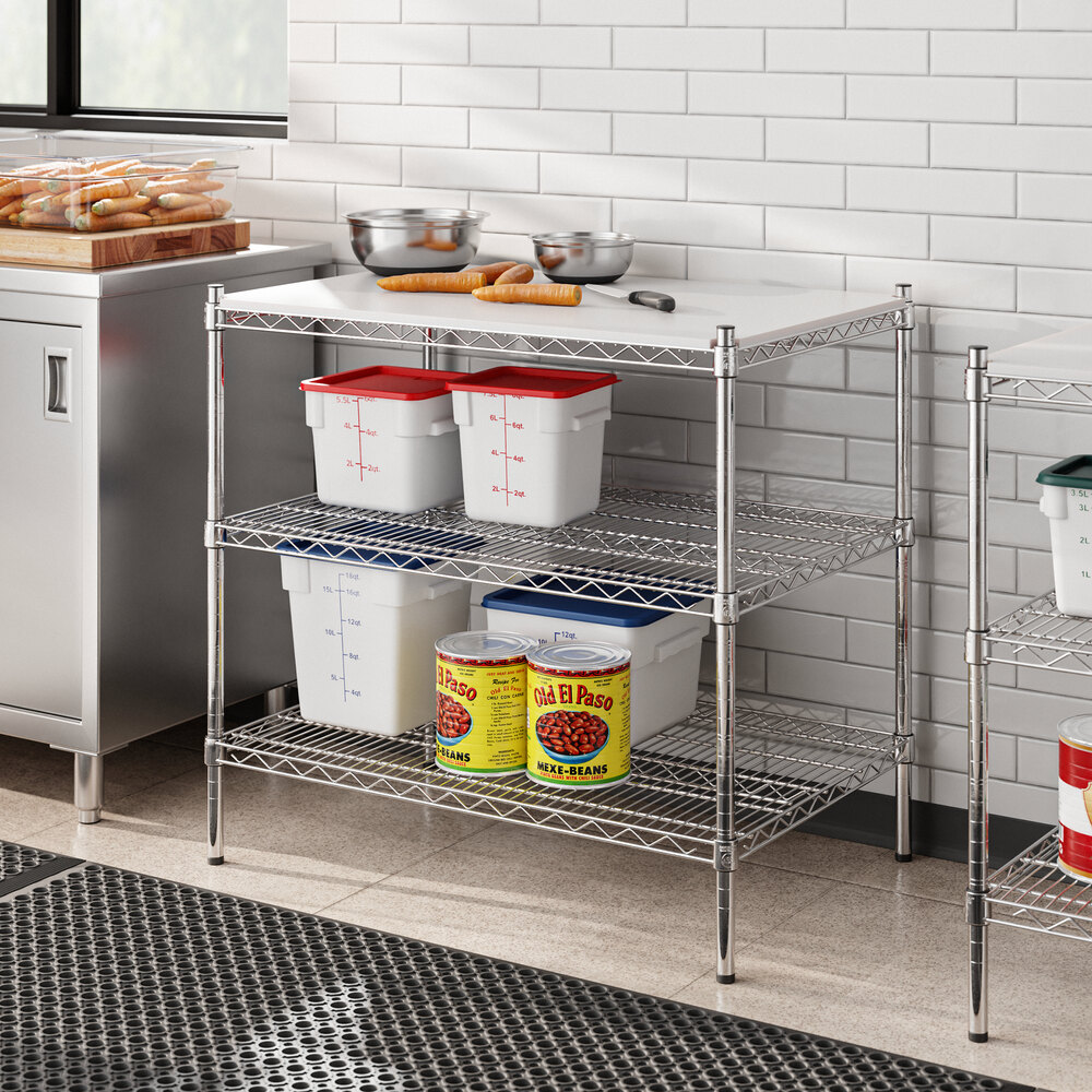 Regency metal shelving with food containers on the shelves.