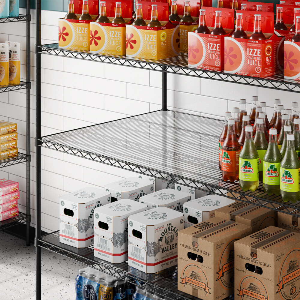 A clear PVC shelf liner placed on a metal wire shelving unit.