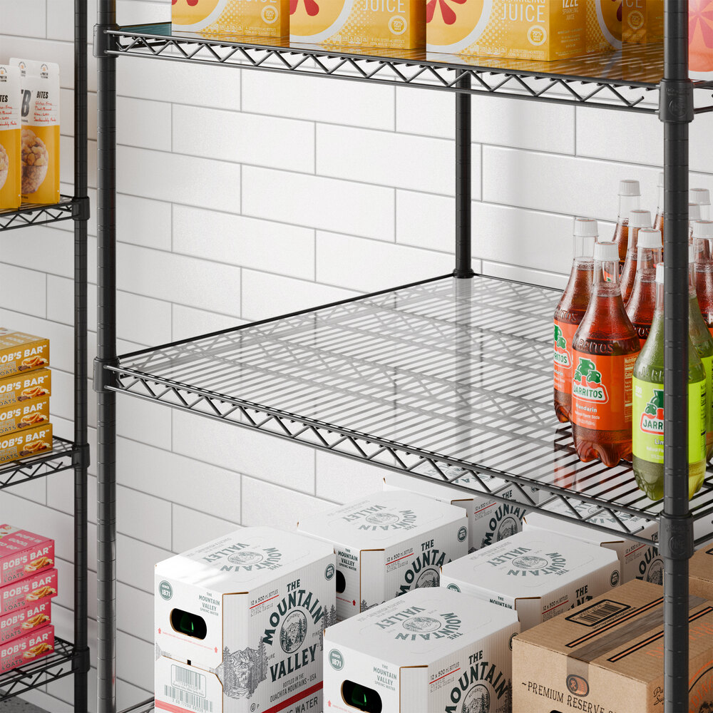 A clear PVC shelf liner placed on a metal wire shelving unit.