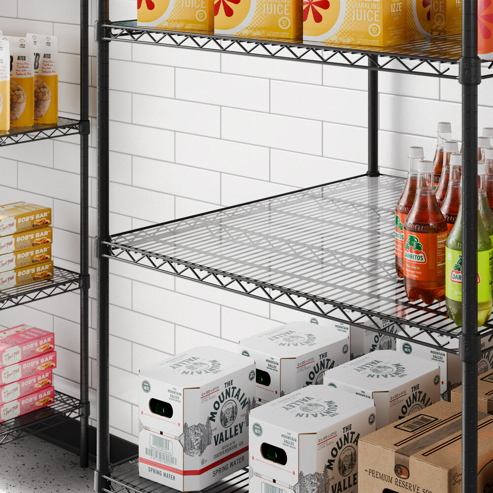 A clear PVC shelf liner placed on a wire shelving unit.