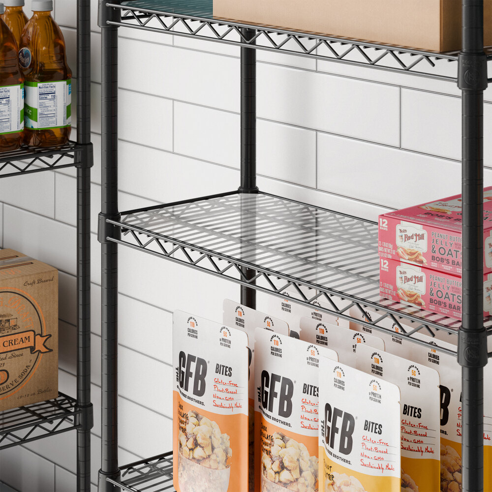 A clear PVC shelf liner placed on a black wire shelving unit.