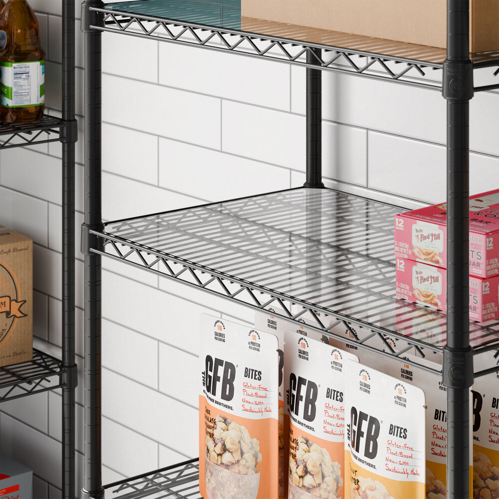 A clear PVC shelf liner placed on a wire shelving unit.