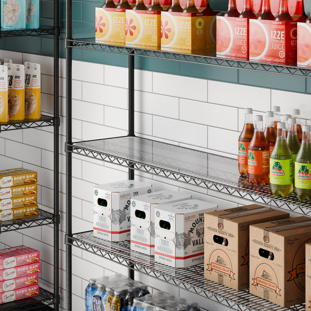 A clear PVC shelf liner placed on a metal wire shelving unit.