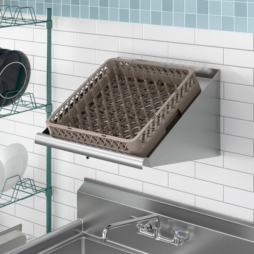 A wall-mounted slanted rack shelf with a plastic dish rack placed on top.