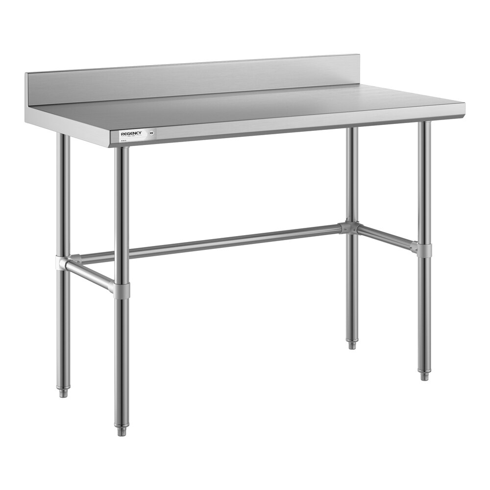 A stainless steel work table with an open base, four legs, and a 4-inch backsplash along the back edge.