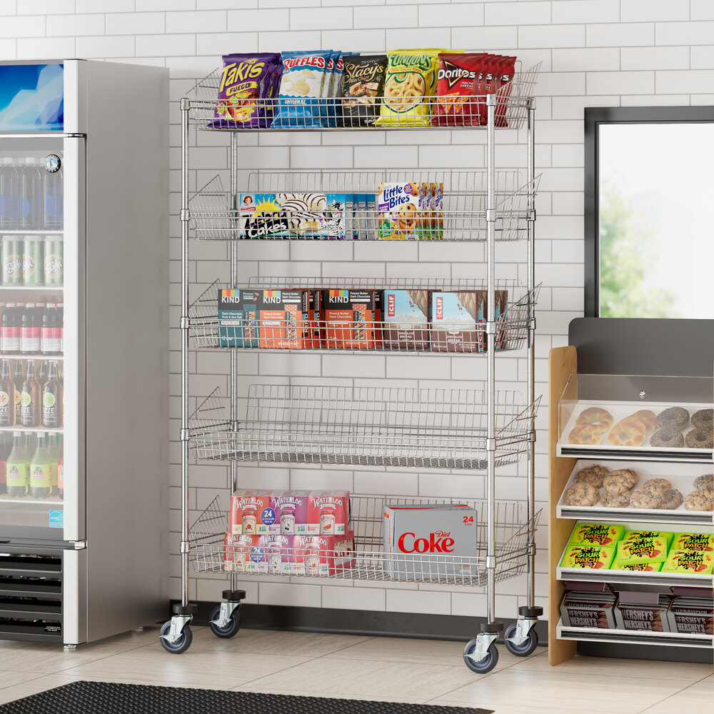 A Regency chrome mobile 5 basket retail display stand filled with food and snacks.
