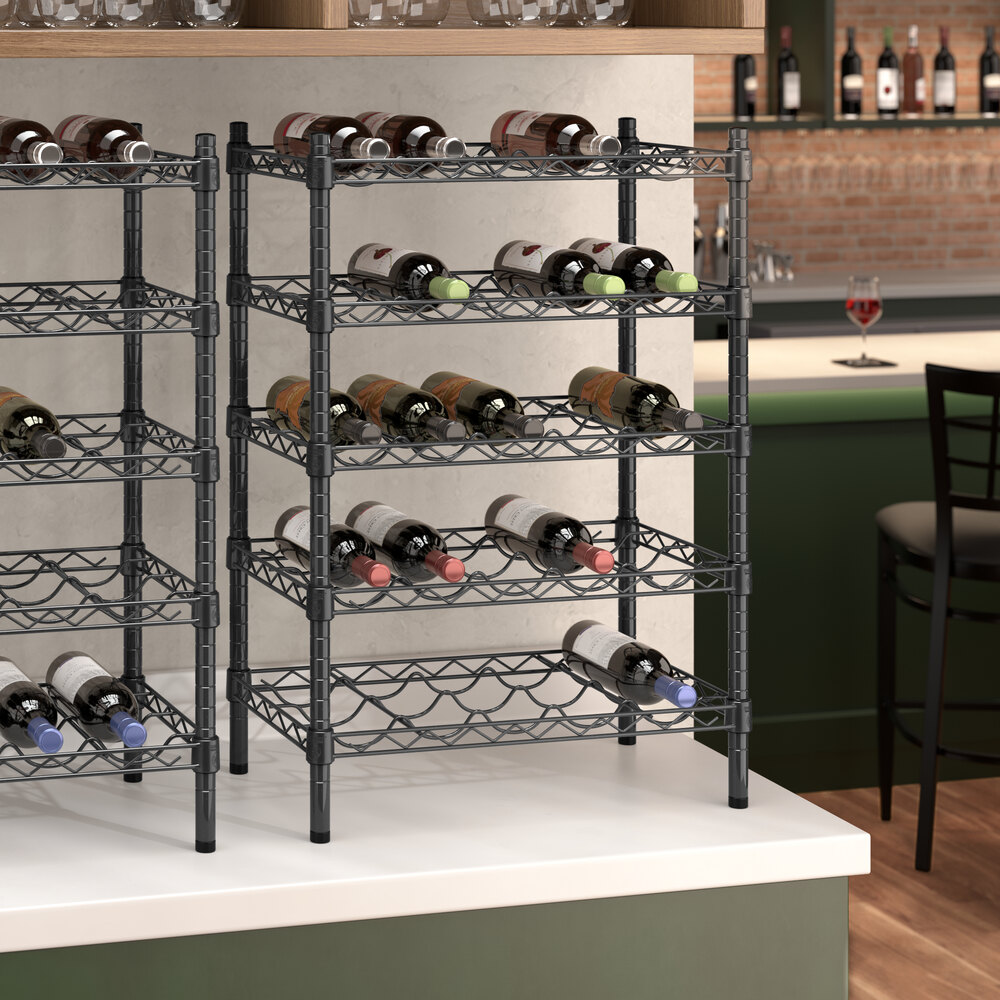 A Regency black epoxy wire wine rack with wine bottles on it.