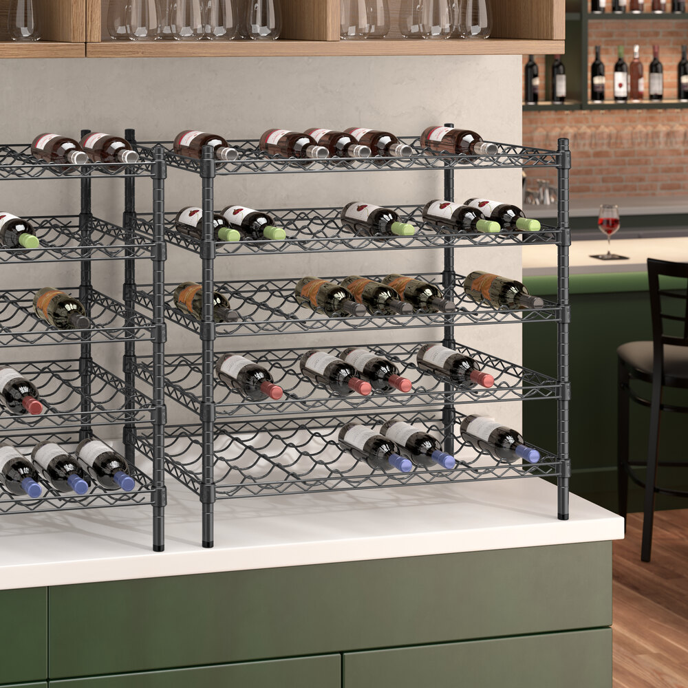A Regency black wire wine rack with bottles on it.