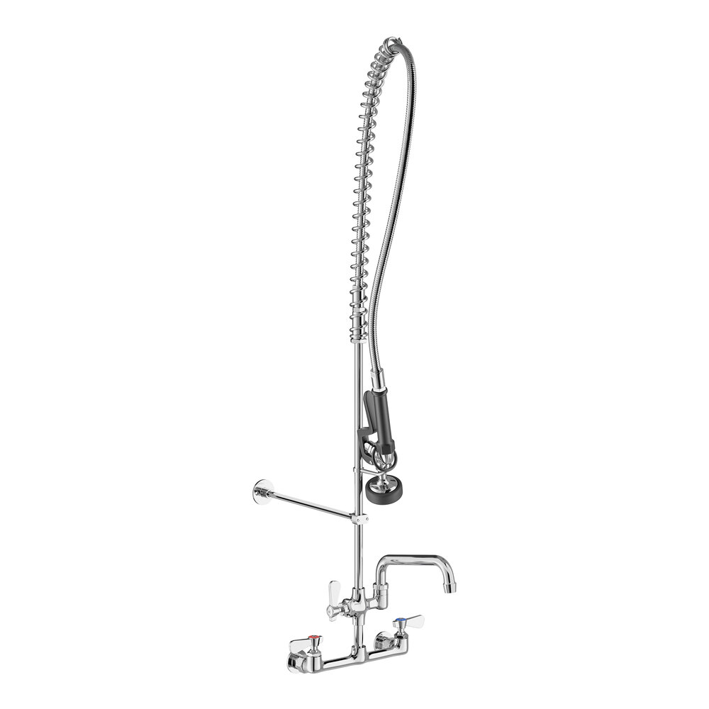 A tall, wall-mounted chrome faucet with a flexible hose, spray nozzle, and an additional spout, featuring two handles for hot and cold water.