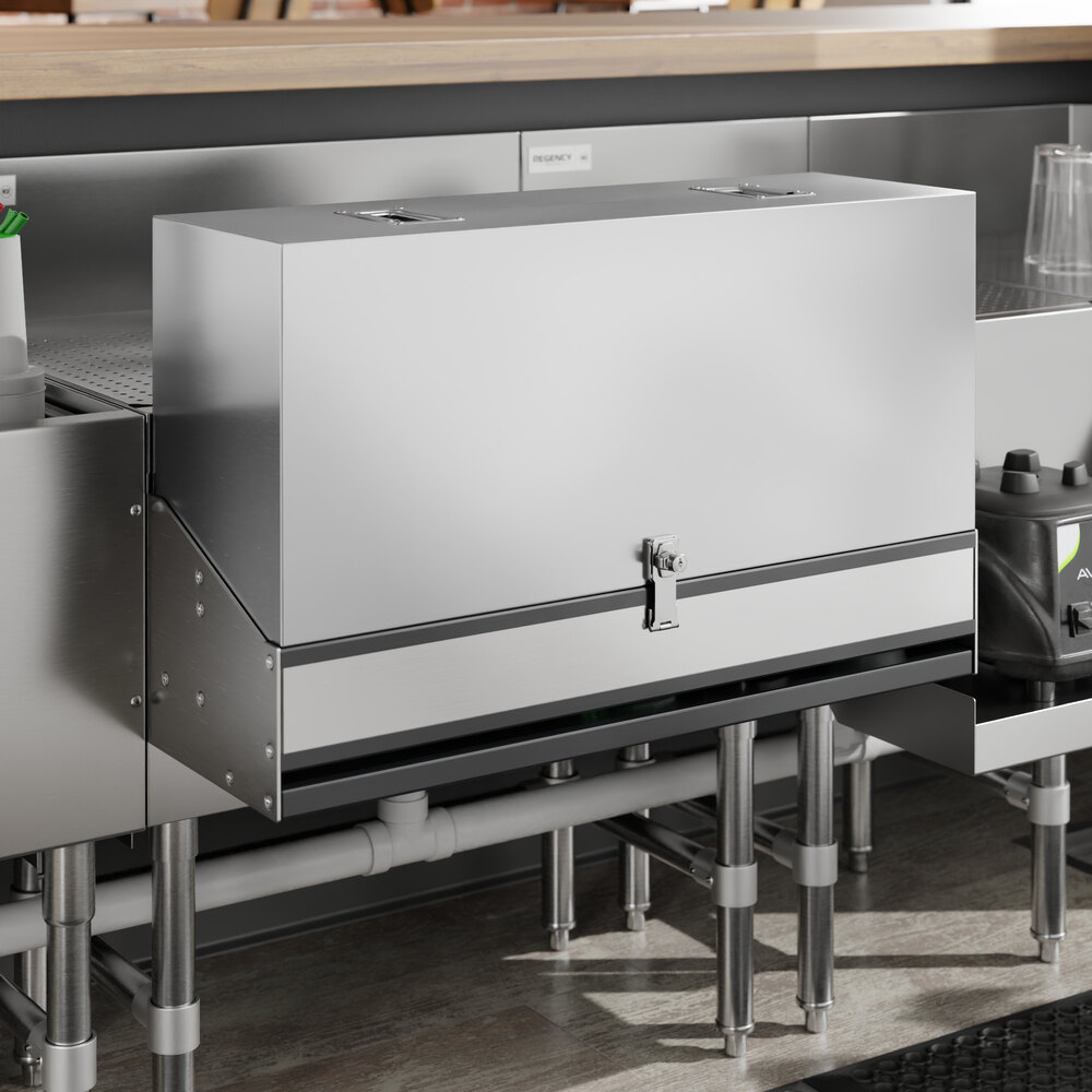 A stainless steel cover for a Regency double tier speed rail on a counter in a professional kitchen.