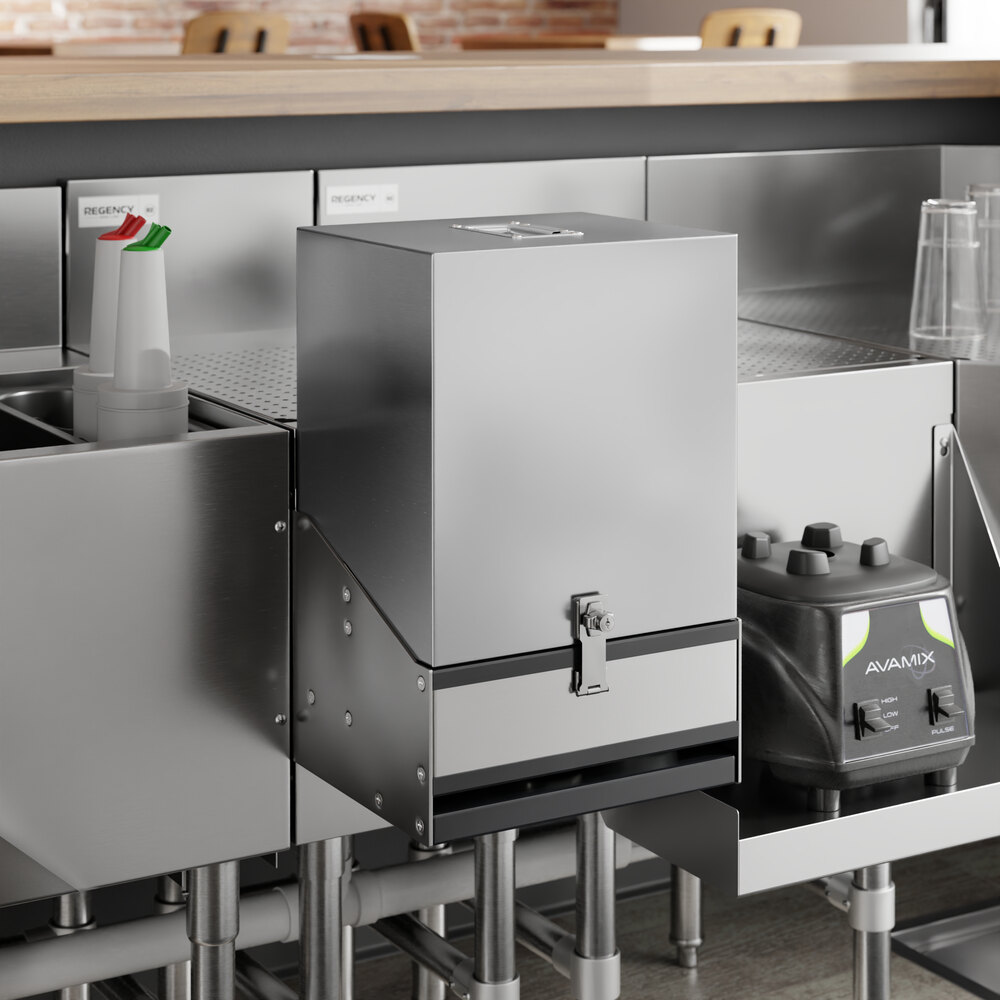 A stainless steel cover for a double tier speed rail on a metal surface.