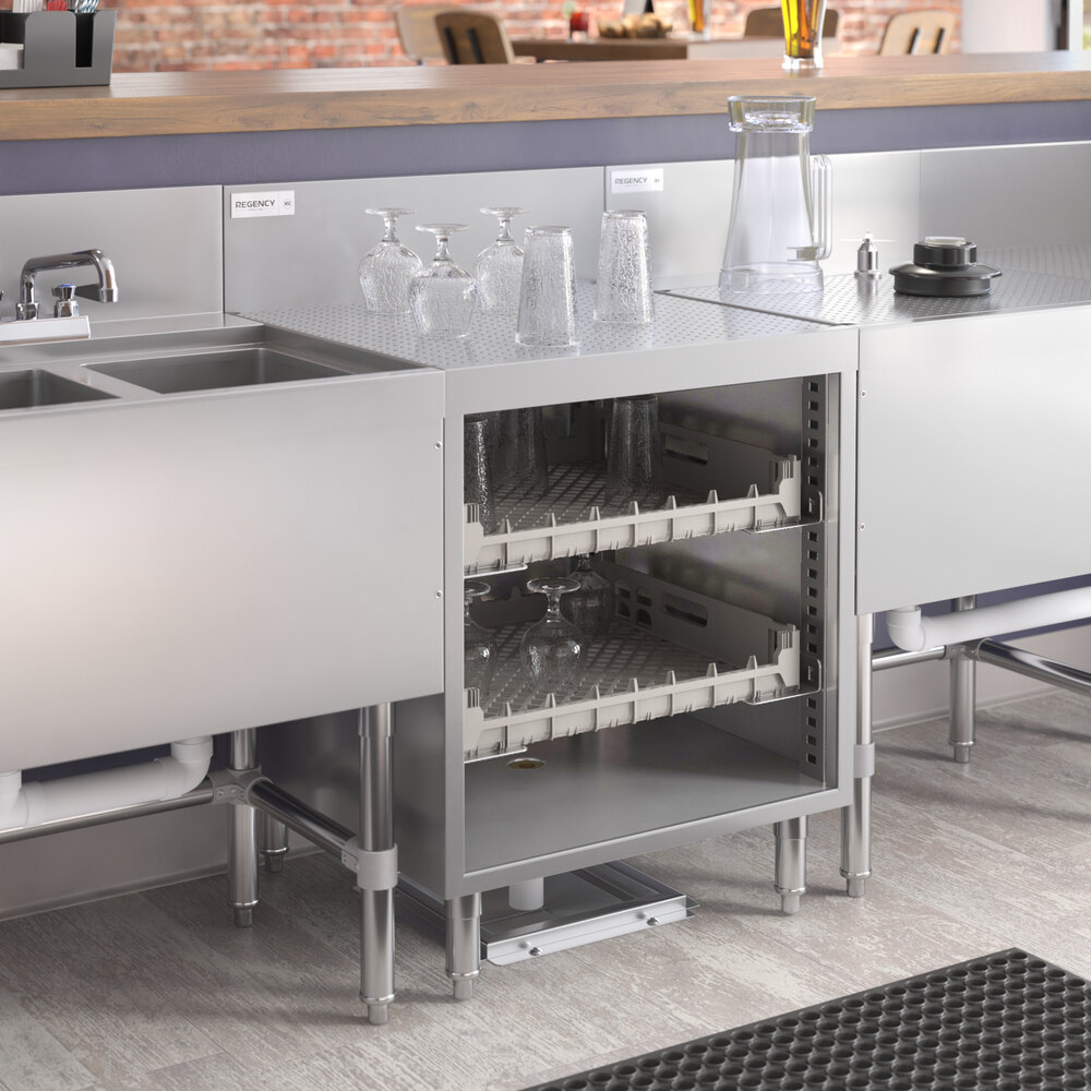 A Regency stainless steel glass rack storage unit on a counter above a sink.