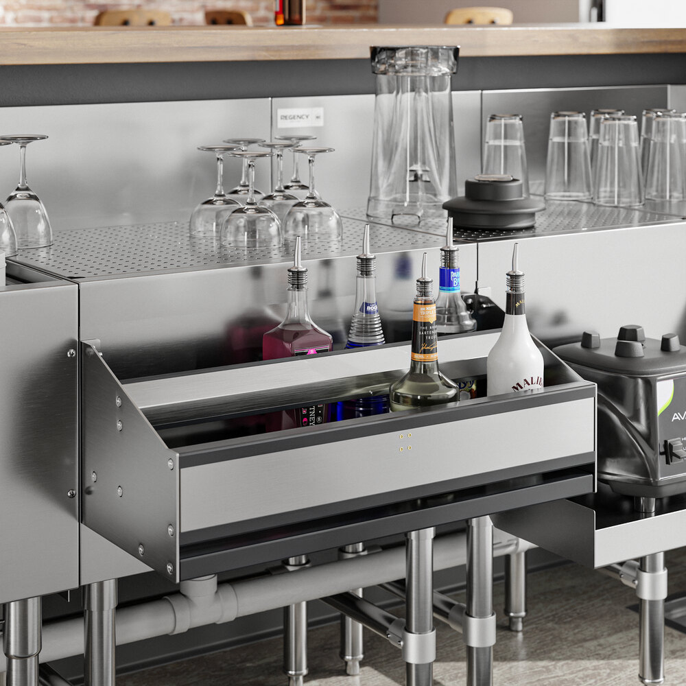 A Regency stainless steel double tier speed rail on a bar with wine glasses.
