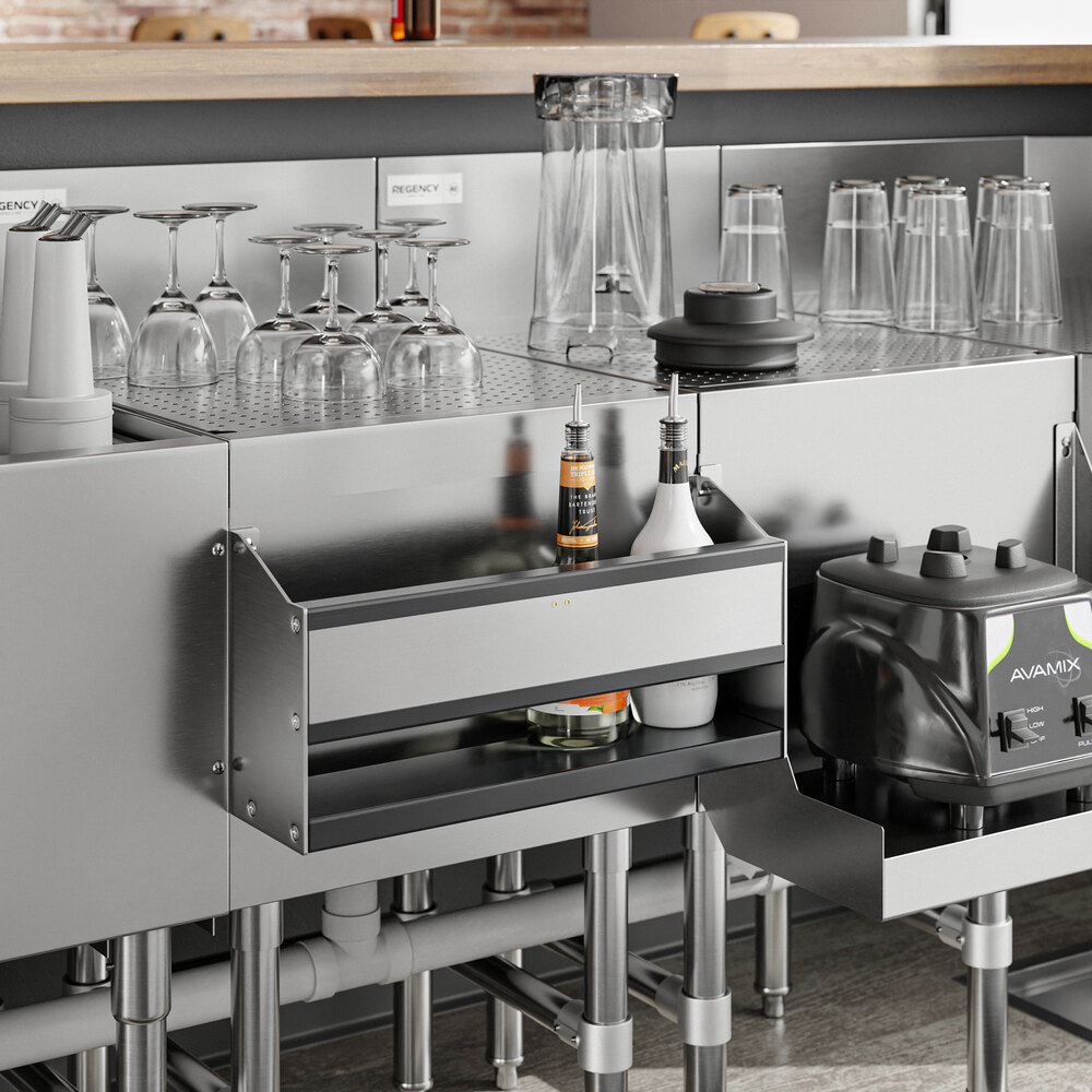 A Regency stainless steel speed rail on a counter with wine glasses.