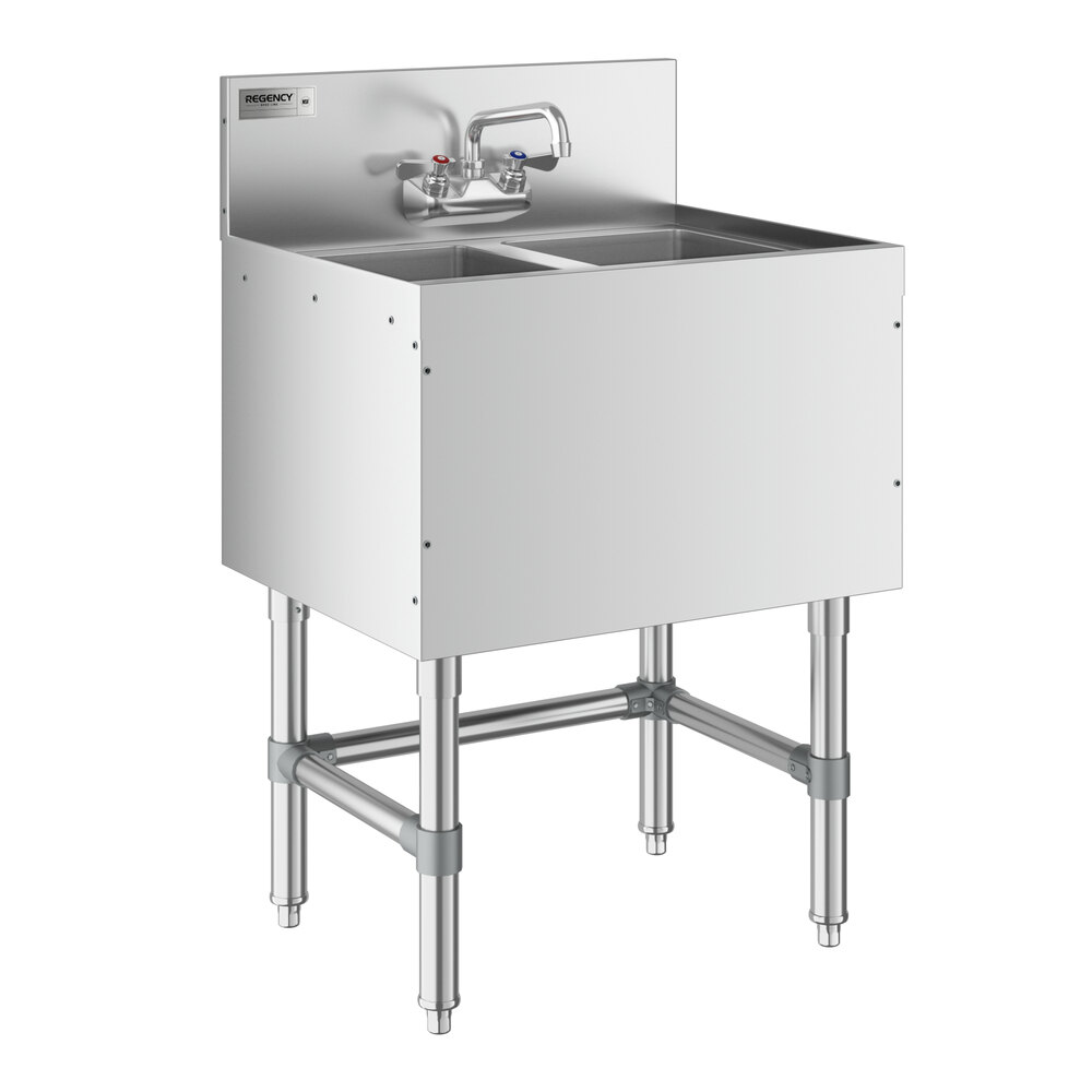 A Regency stainless steel underbar sink with two faucets.