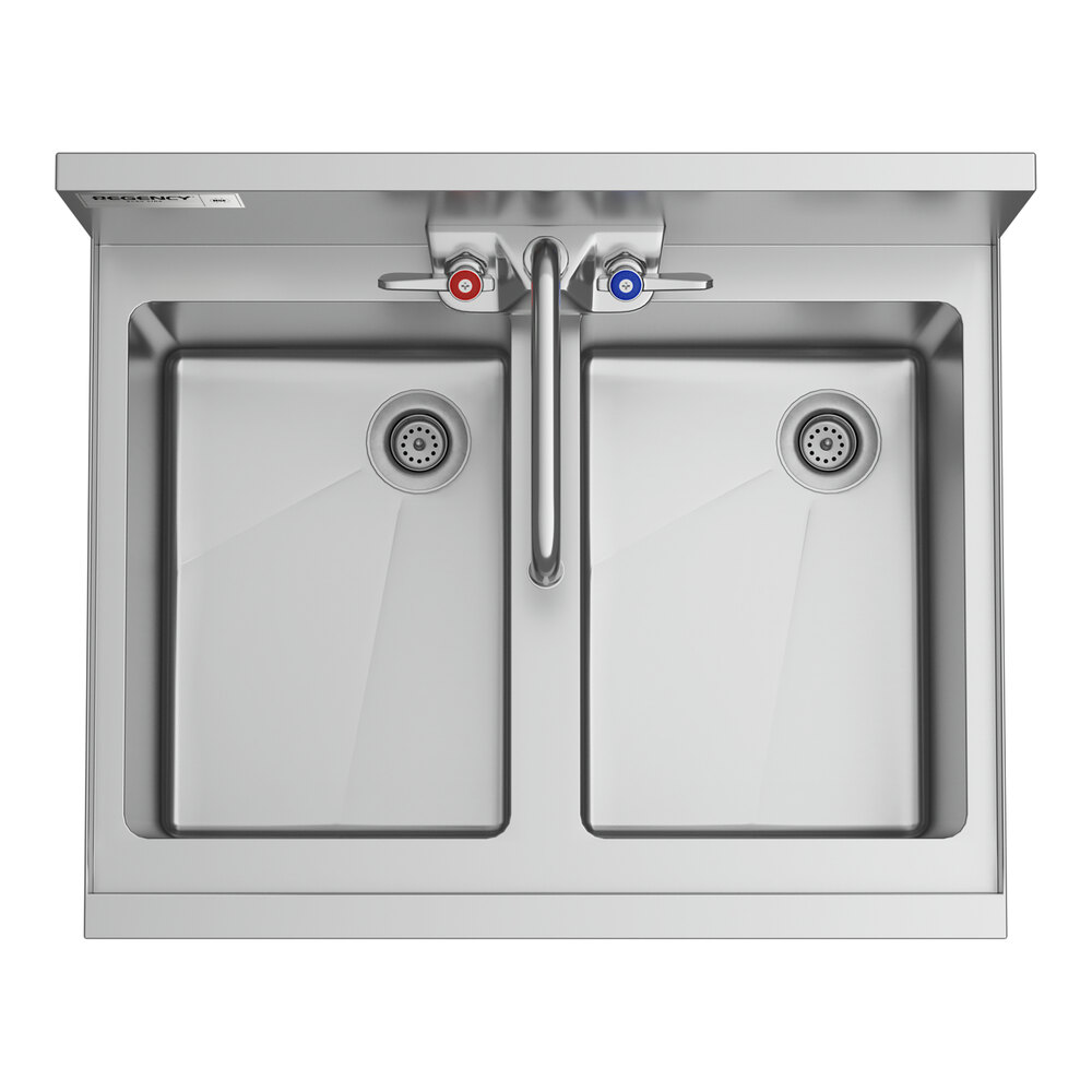 A Regency stainless steel underbar sink with two faucets.