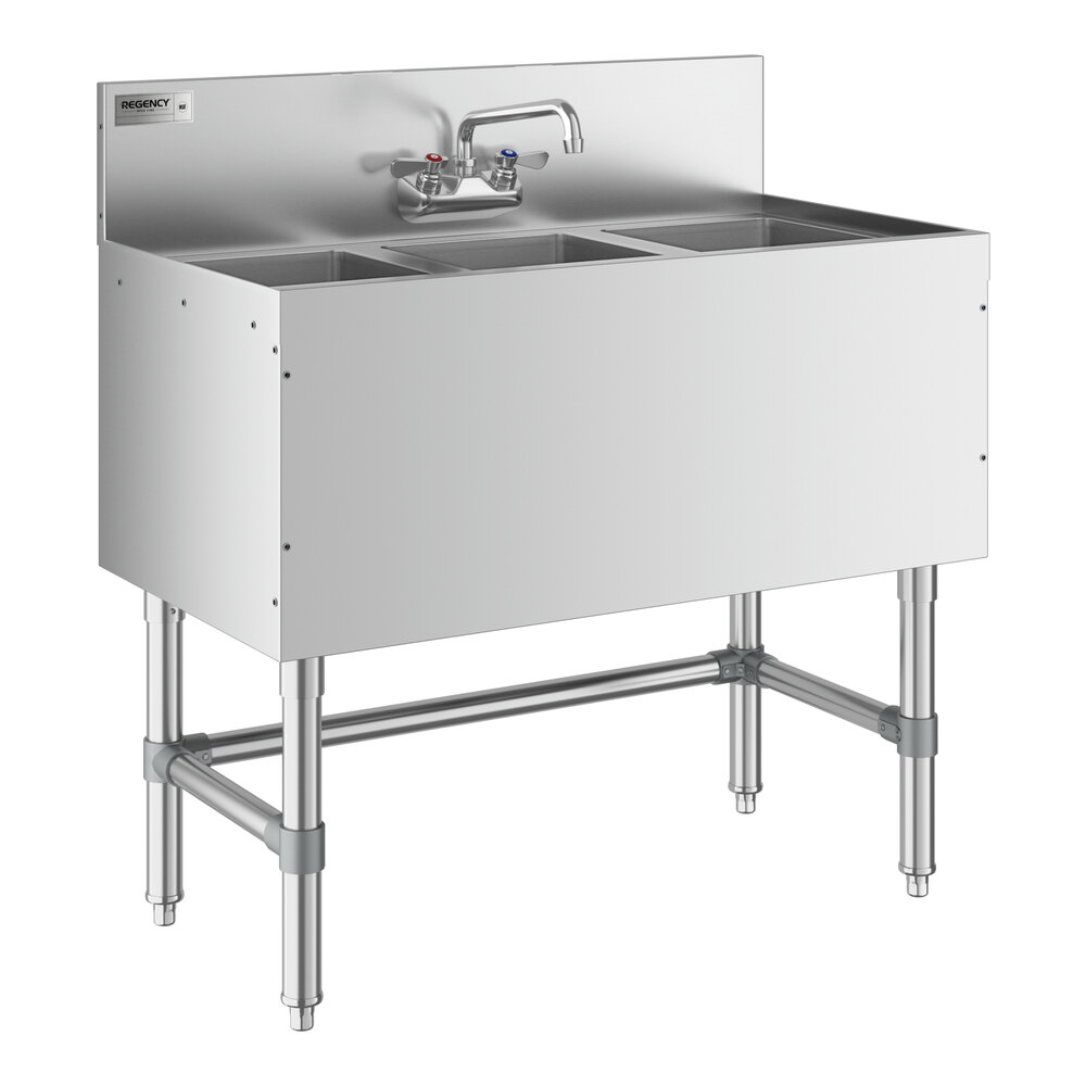 A Regency stainless steel underbar sink with three compartments and a faucet.