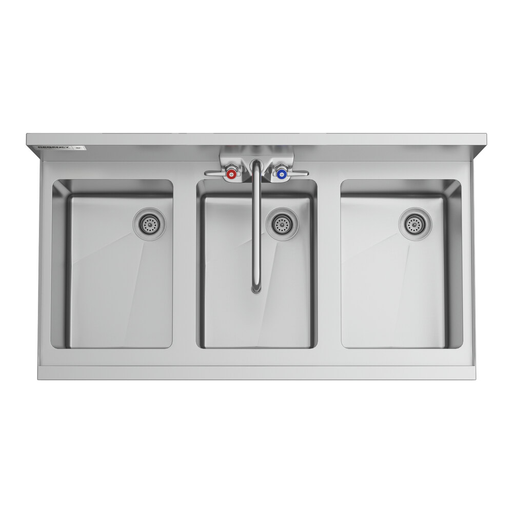 A Regency stainless steel underbar sink with three bowls and faucets.