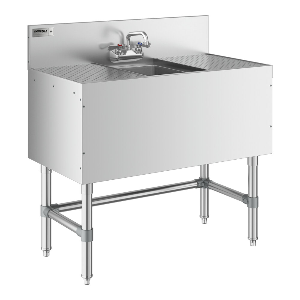 A Regency stainless steel underbar sink with (2) 12" drainboards and a faucet.