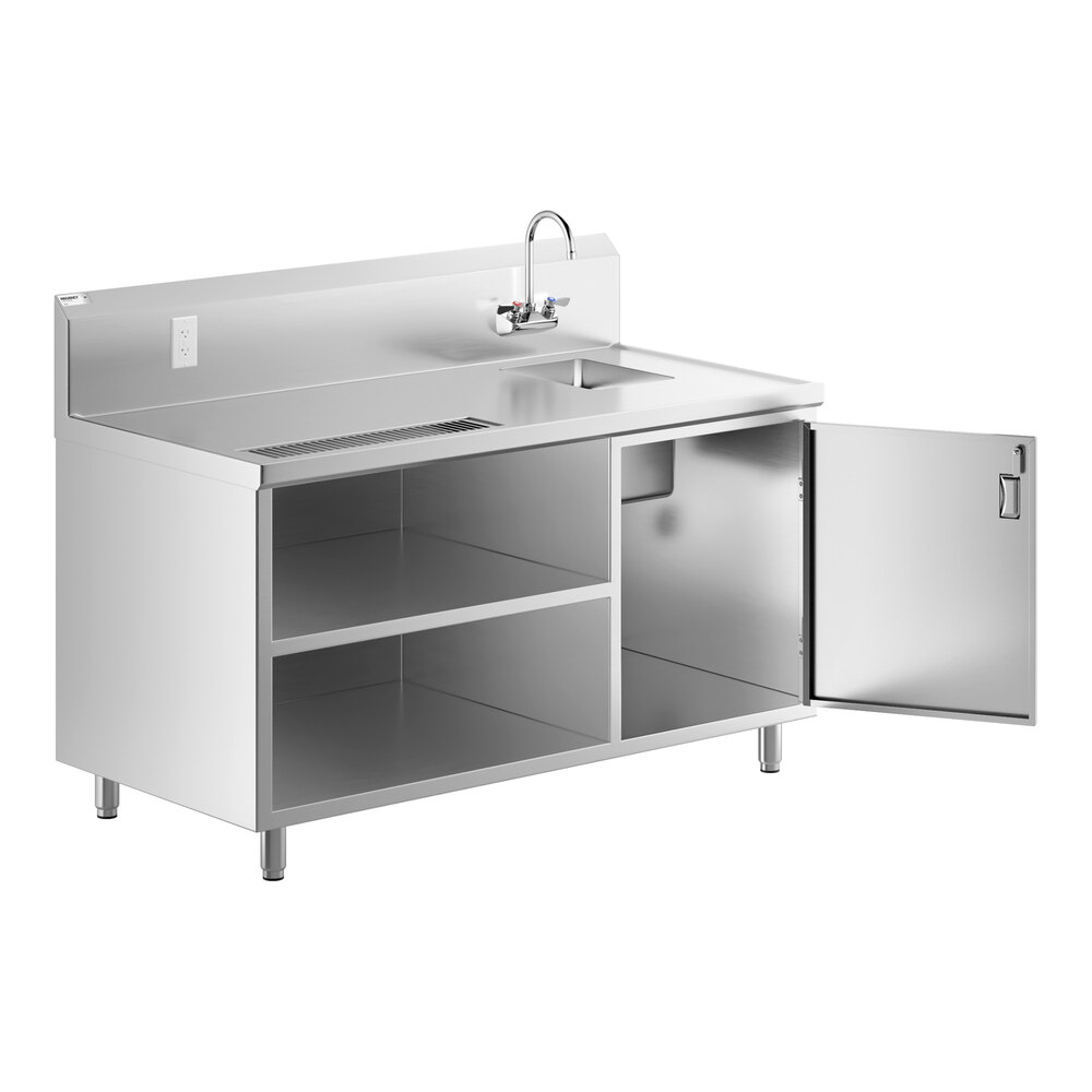 A stainless steel beverage table with a right-side sink, gooseneck faucet, backsplash, open shelving, and one cabinet door open to reveal storage space.